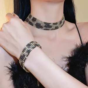 Detailed view of an elegant rhinestone leopard print choker necklace and matching bracelet set