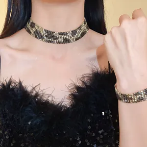 Close-up of sparkling leopard print rhinestone choker and matching bracelet set on model