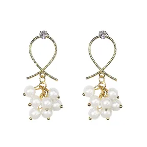 Elegant Korean style gold pearl drop earrings with silver needles and crystal accents