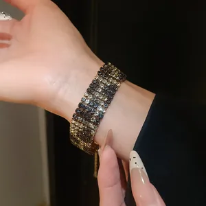 Close-up of vintage leopard print rhinestone choker with shimmering black and gold stones