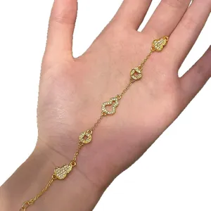 Elegant gold plated bracelet with zircon-encrusted gourd and ancient coin charms