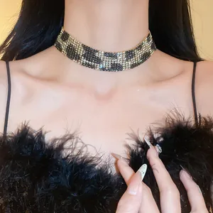 Detailed view of a vintage leopard print rhinestone choker necklace worn by a model