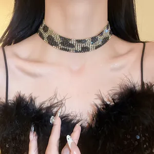 Close-up macro view of wide rhinestone leopard print choker necklace on model's neck