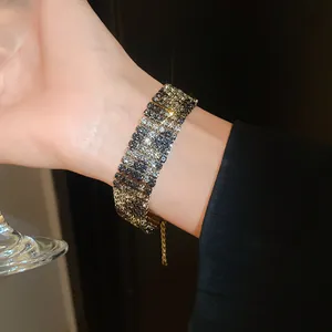 Macro detail of a wide vintage rhinestone cuff bracelet with elegant leopard pattern