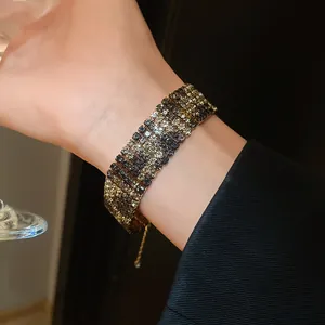 Elegant wide rectangular rhinestone bracelet with leopard print gradient detail on wrist