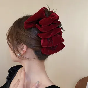 Elegant burgundy velvet multi-layer bow hair claw clip with glitter and feather detail