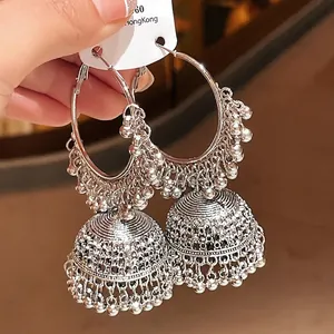 Elegant ethnic silver-toned hoop earrings featuring intricate bell tassel charms.