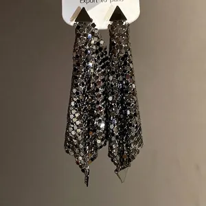 Elegant silver needle triangle stud earrings featuring long shimmering sequin tassels