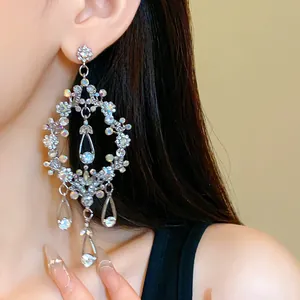 Sparkling silver rhinestone tassel drop earrings for elegant evening dress outfits.