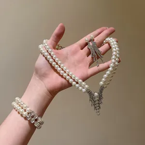 Elegant double-layer pearl necklace jewelry set with shimmering rhinestone accents