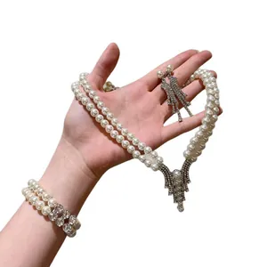 Elegant French double-layer pearl necklace bracelet and earring set with rhinestones