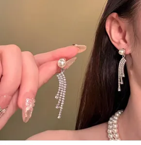 Detailed shot of French style rhinestone pearl earrings and double-layer necklace set