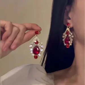Elegant teardrop earrings featuring red crystals and sparkling rhinestones for formal events