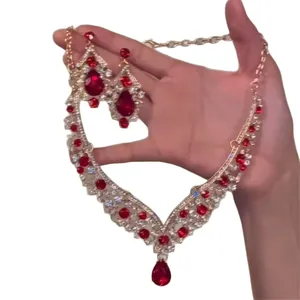 Vintage red teardrop rhinestone necklace and earring set in gold tone for special occasions