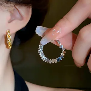 Elegant silver needle hoop earrings set with sparkling cubic zirconia for a luxury look