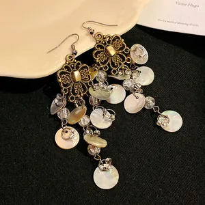 Vintage Bohemian flower drop earrings with dangling mother-of-pearl disks and beads