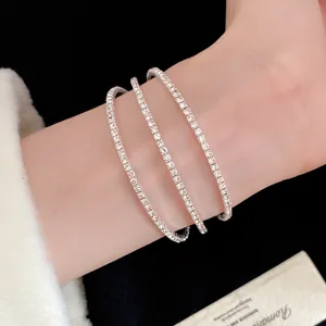 Detailed view of elegant triple-layered silver tennis bracelet set with sparkling zircon stones