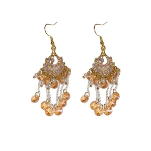 Elegant Bohemian gold tassel earrings featuring amber faceted glass drops and white pearls