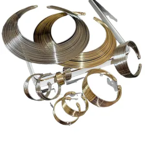 Metallic geometric multi-layer necklace set with matching bracelets and hoop earrings