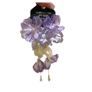 Purple fabric flower earrings with pearls and waterdrop tassels on silver pins