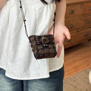Handcrafted bohemian style necklace bag made from polished natural coconut shells
