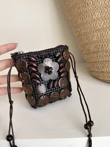 Handmade Bohemian ethnic necklace pouch with circular coconut shell and bead decorations