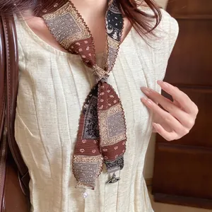 Bohemian retro fabric necklace with iconic Saturn orb pendant and elegant pearl drop detail