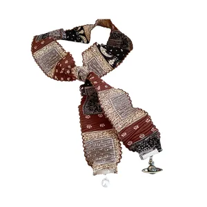 Vintage pleated fabric scarf necklace with pearl and Saturn orb pendant accessory