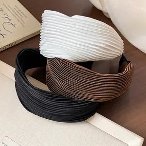 Elegant set of three pleated wide fabric headbands in white, brown, and black colors