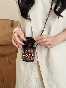 Detail of Bohemian ethnic style coconut shell bead necklace coin purse for women