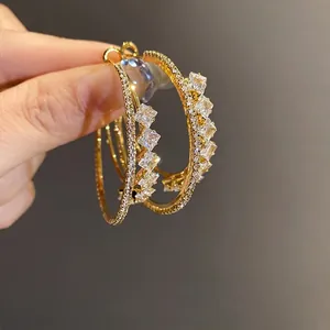 Elegant double-layered 18k gold plated hoop earrings with sparkling zirconia stones