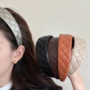 Quilted faux leather headbands in multiple colors for a stylish high-top hair look.