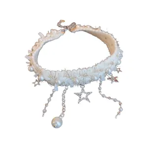 Elegant white plush choker necklace featuring rhinestone stars and hanging pearl tassels