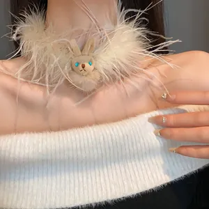 Close-up of white fluffy feather choker necklace with a cute plush bunny pendant