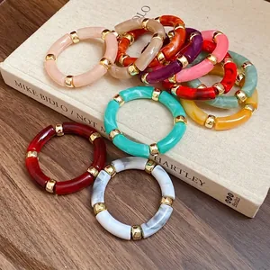 Stackable colorful acrylic segment bracelets with gold metal spacers in vintage style