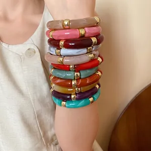 Vibrant colorful acrylic marble textured barrel-bead bracelets with elegant gold spacers
