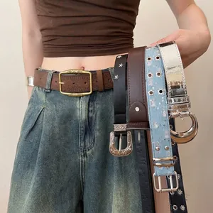 Stylish Western-style leather belts with metallic buckles and star stud details