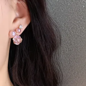 Detailed view of elegant floral pearl earring with sparkling cubic zirconia inlay design