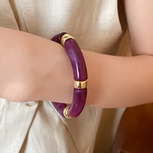 Detail view of purple marbled acrylic bracelet with gold-toned metal accents