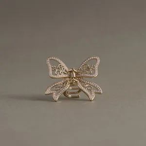 Elegant hollow butterfly bow hair claw clip with exquisite pearl embellishments for women