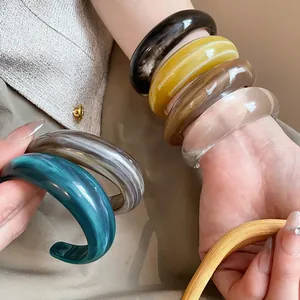 Modern chunky acrylic resin geometric bangles with stylish marble texture variety