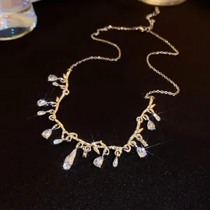 Detail view showing the elegant silver branch design and sparkling water drop rhinestones