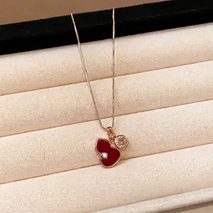 Elegant red enamel gourd pendant necklace with cubic zirconia accents