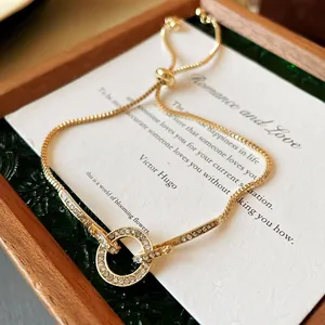 Detailed macro shot of adjustable gold bracelet with sparkling crystal paved circle
