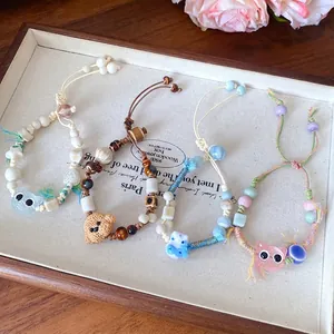 Handmade ceramic beaded bracelets with cute cartoon cat and bear charms in vintage style