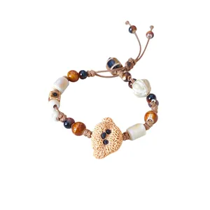 Handmade ceramic beaded bracelet with cute cat charm and adjustable wax cord