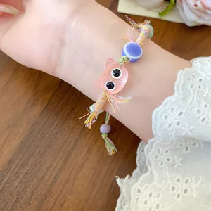 Cute handmade ceramic cat charm woven bracelet featuring colorful wax rope details