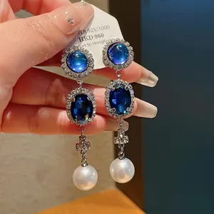 Elegant French vintage dangle earrings with blue gemstones and large white pearls