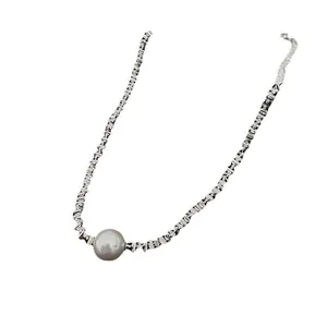 Elegant minimalist silver geometric chain necklace featuring a single grey pearl pendant