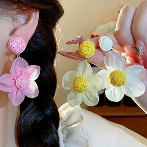 Elegant handmade raffia and chiffon flower stud earrings for women in assorted colors.